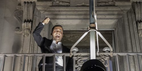Luigi Di Maio, Italy's deputy prime minister, celebrates on the balcony of the Chigi palace following the presentation of the budget targets at a cabinet meeting in Rome, Italy, on Thursday, Sept. 27, 2018. Italys coalition government agreed on a 2019 deficit at 2.4 percent of GDP during a late-night cabinet meeting in Rome where the governments two political heavyweights demanded a budget deficit target of 2.4 percent to finance their election pledges while the finance minister tried to keep the shortfall to 2 percent. Photographer: Alessia Pierdomenico/Bloomberg via Getty Images