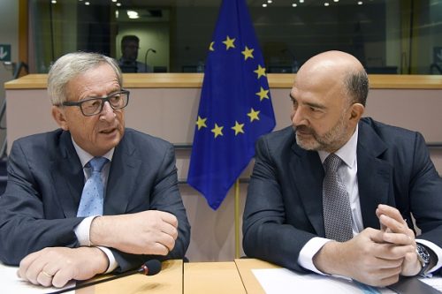 European Commission President Jean-Claude Juncker (L) and Economic and Financial Affairs commissioner Pierre Moscovici (R) attend an hearing on September 17, 2015 organized by European Parliament's special committee on tax rulings and other similar measures in nature or effect at the European Union headquarters in Brussels. AFP PHOTO/JOHN THYS        (Photo credit should read JOHN THYS/AFP/Getty Images)